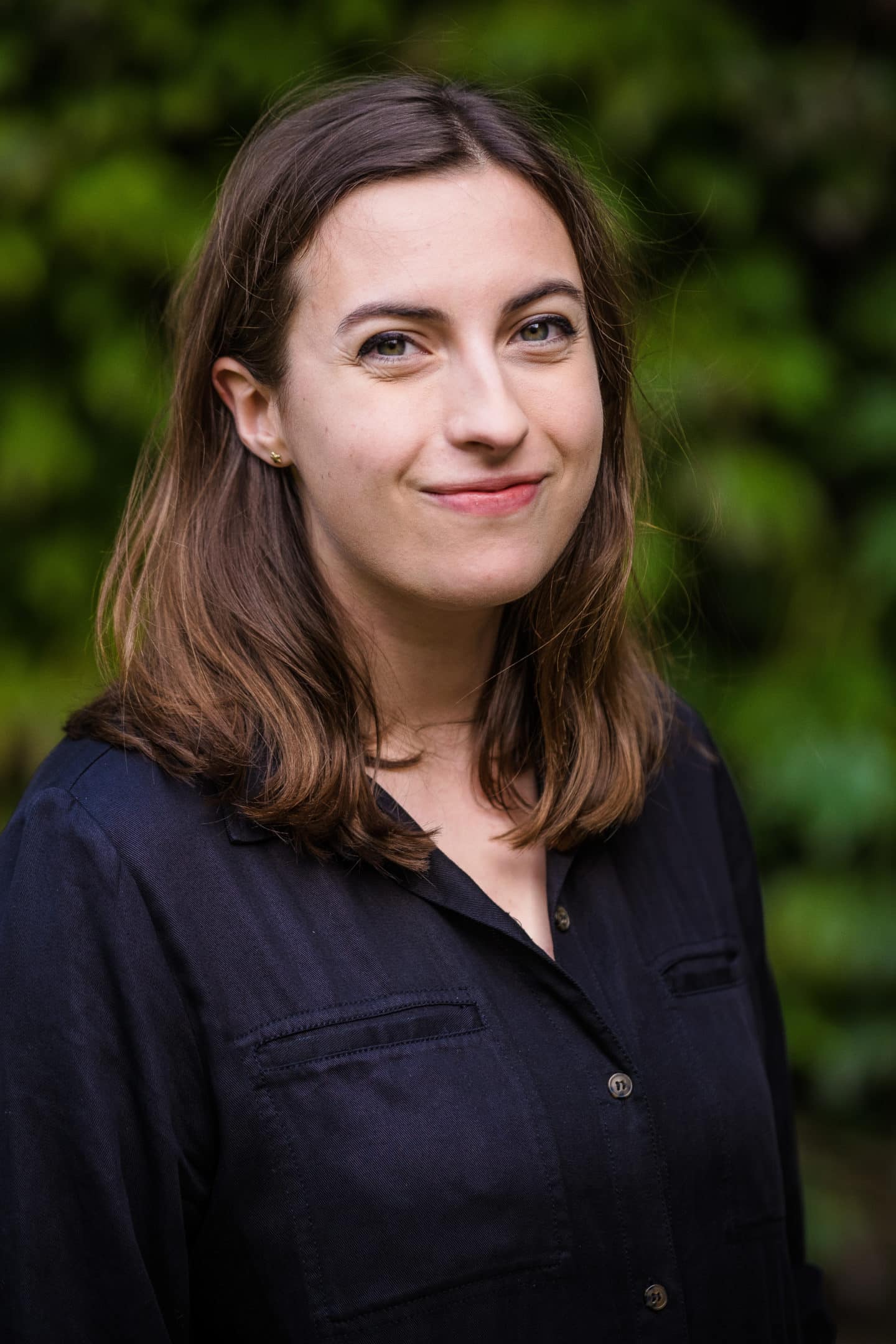 Headshot of Dr Harriet Soper, a woman in a dark shirt