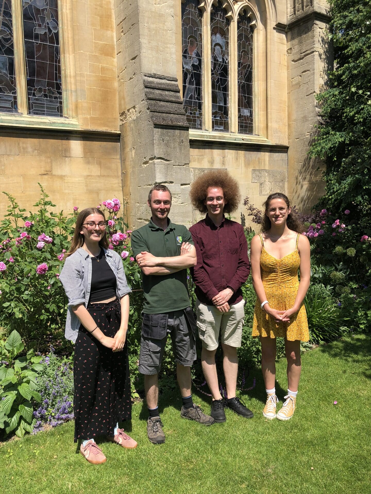 Four members of the Sustainability Team standing in the Rector's Garden