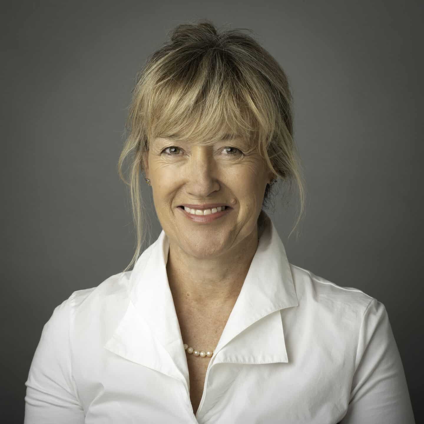 Headshot of Jane Jenkins in a white shirt