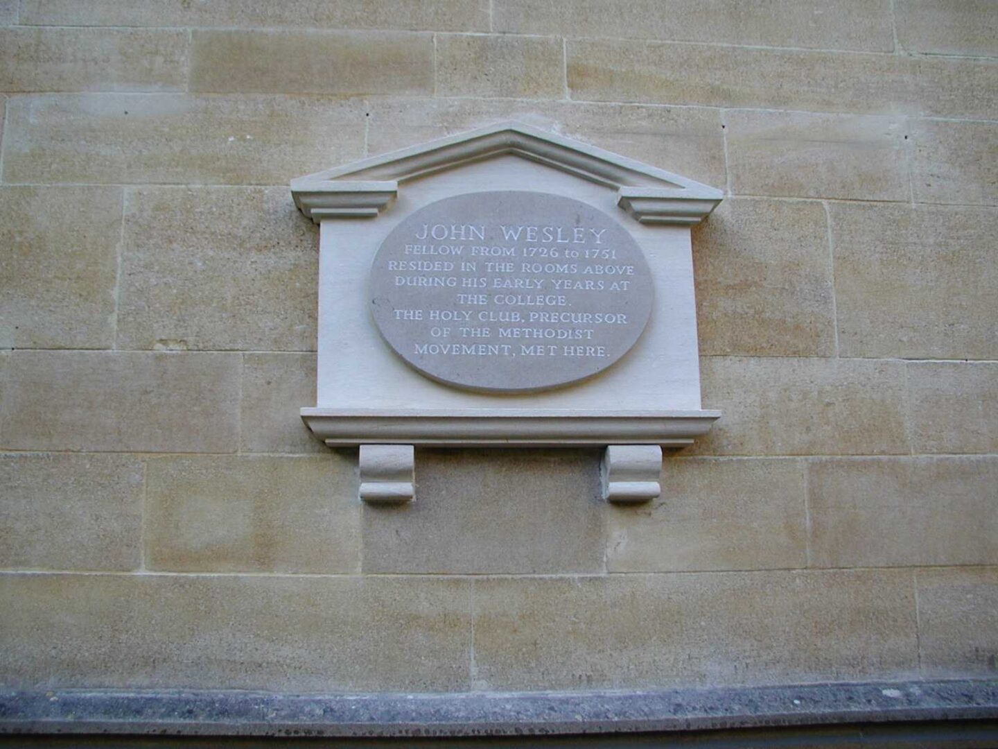 Memorial plaque for John Wesley on the wall of Lincoln College, Oxford, marking the rooms where he lived and where the Holy Club met.