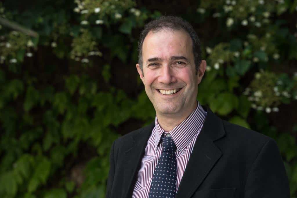 Headshot of Professor Jordan Raff, a man in a suit and tie