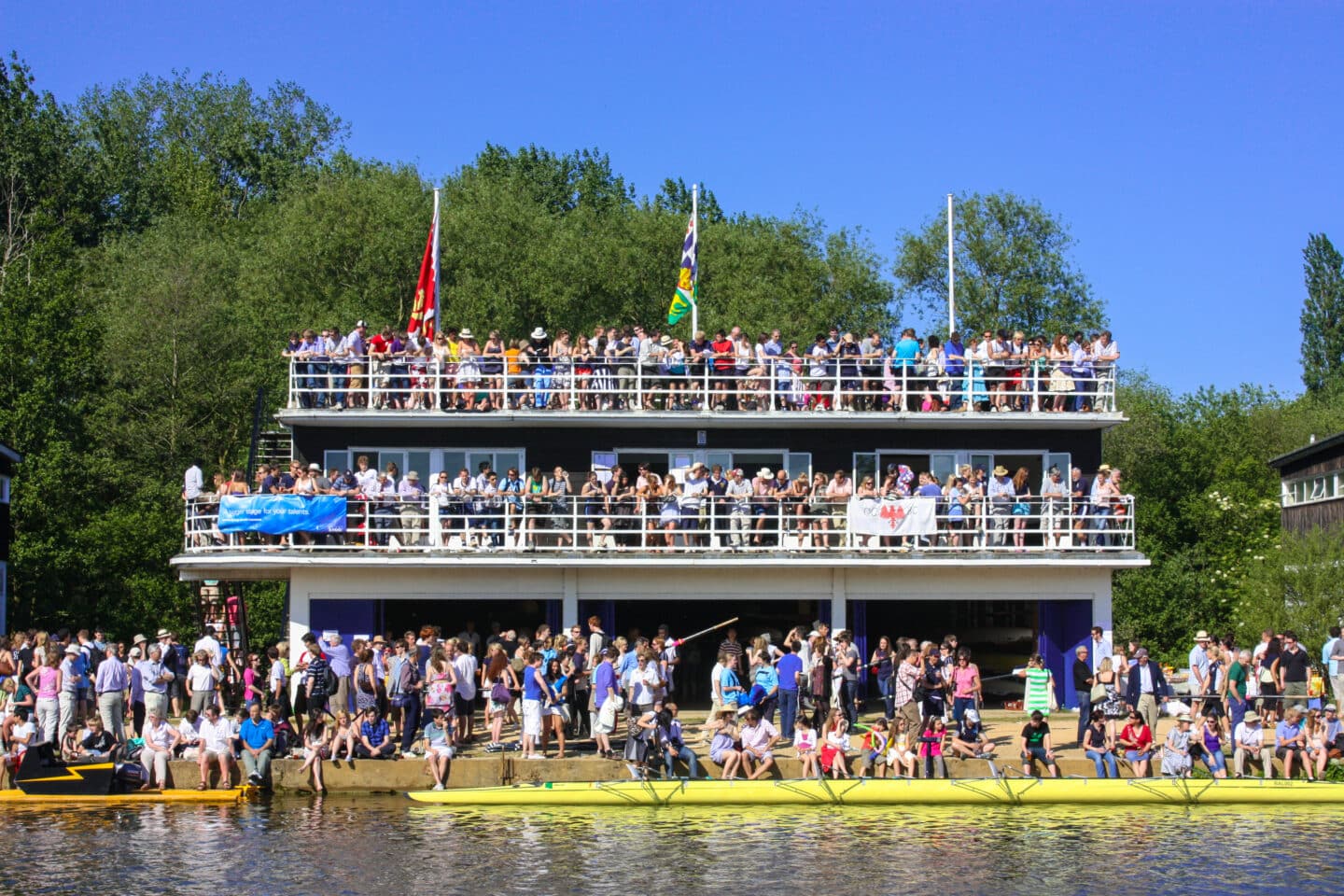 LCBC Boathouse, Summer VIIIs 2009: Crowds of students, alumni and supporters gather outside the Lincoln College Boat Club boathouse during Summer Eights 2009.
