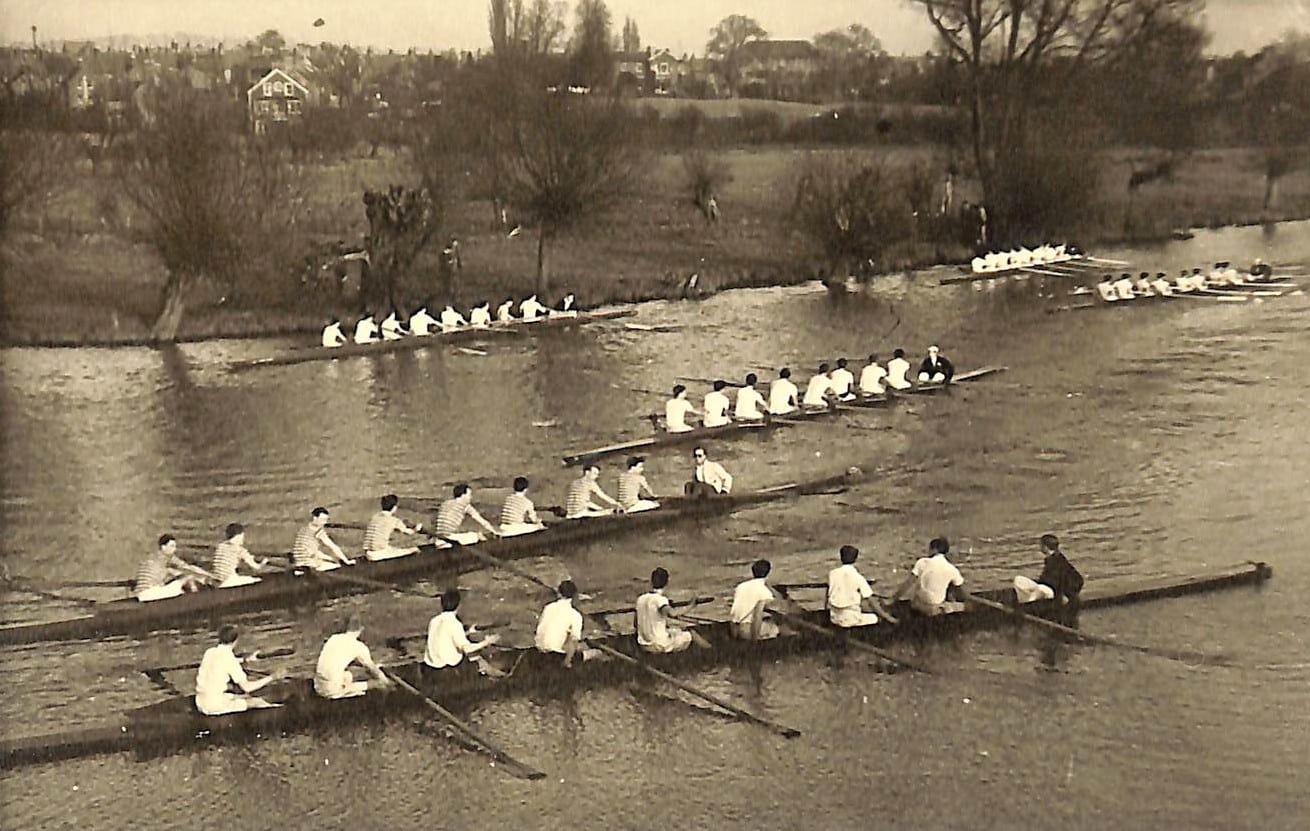 Lincoln College Boat Club on the river in the 1940s: Multiple Lincoln College rowing crews compete on the river during a race in the 1940s.