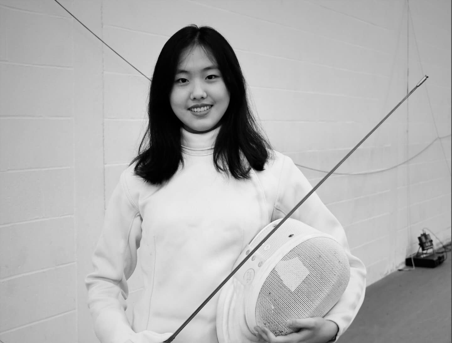 Photo of Lutong Hao in fencing kit