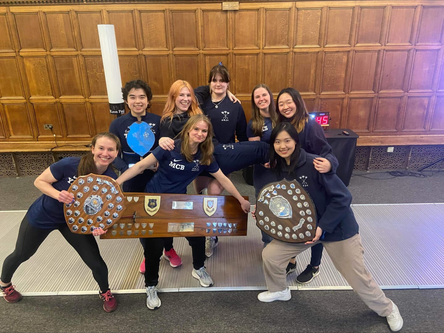 Lutong Hao with the rest of the Blues team holding their award shields