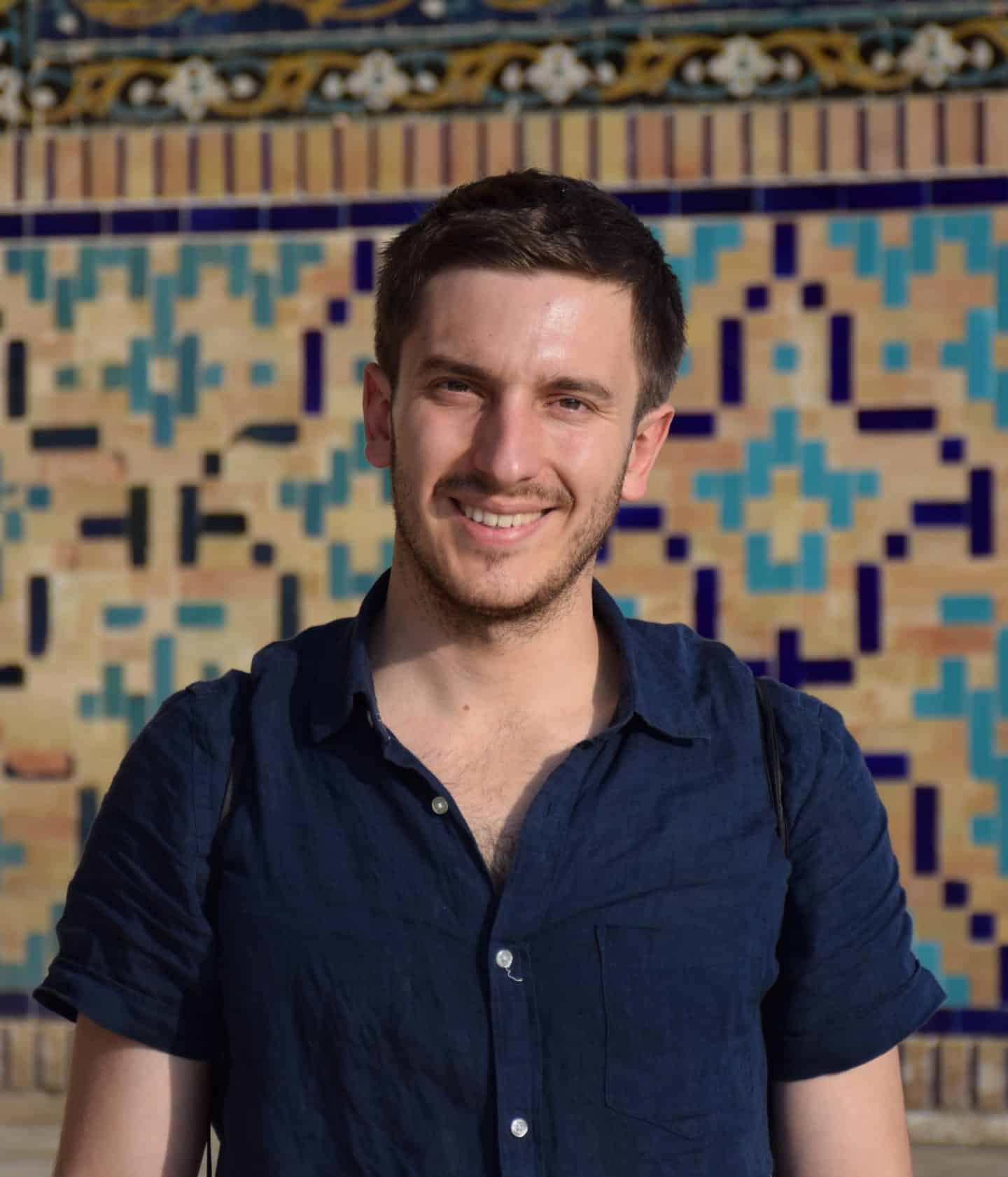 Headshot of Baptiste Verney, a man wearing a short-sleeved blue shirt