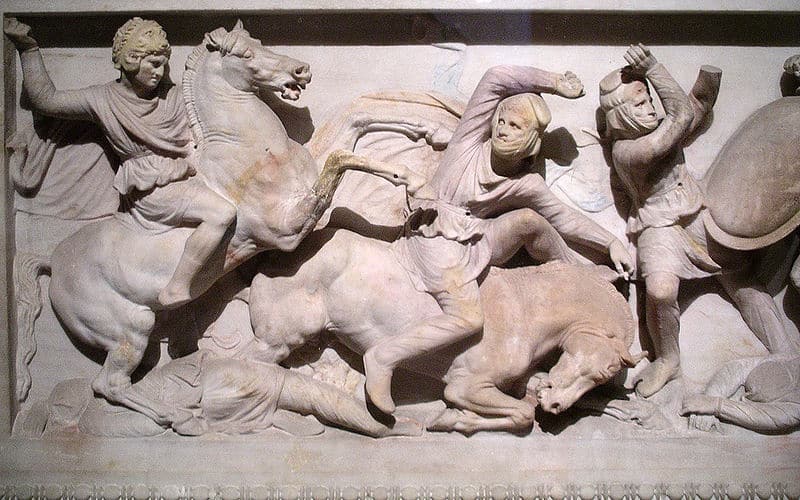 Marble (?) carving of a battle scene with men on horses