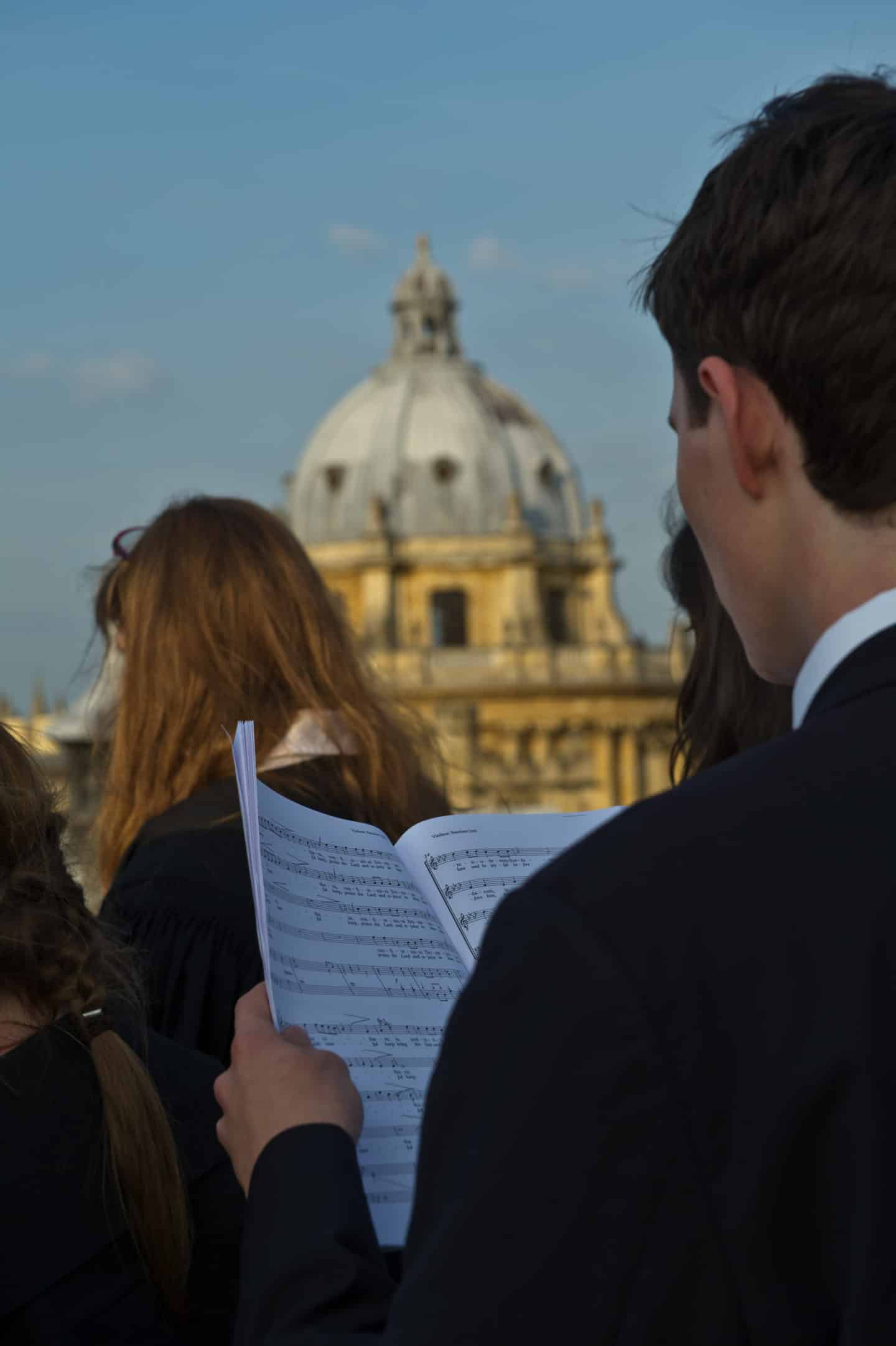 Choir singing on a rooftop