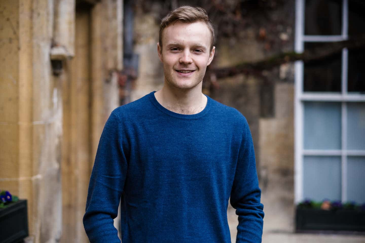 Headshot of Connor Walton, a young man in a blue sweatshirt