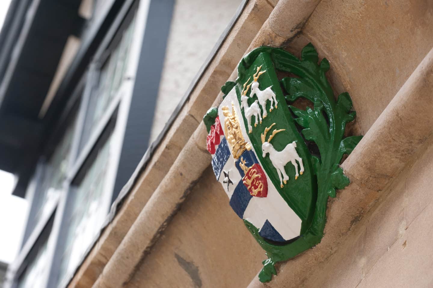 The College crest in Turl Yard