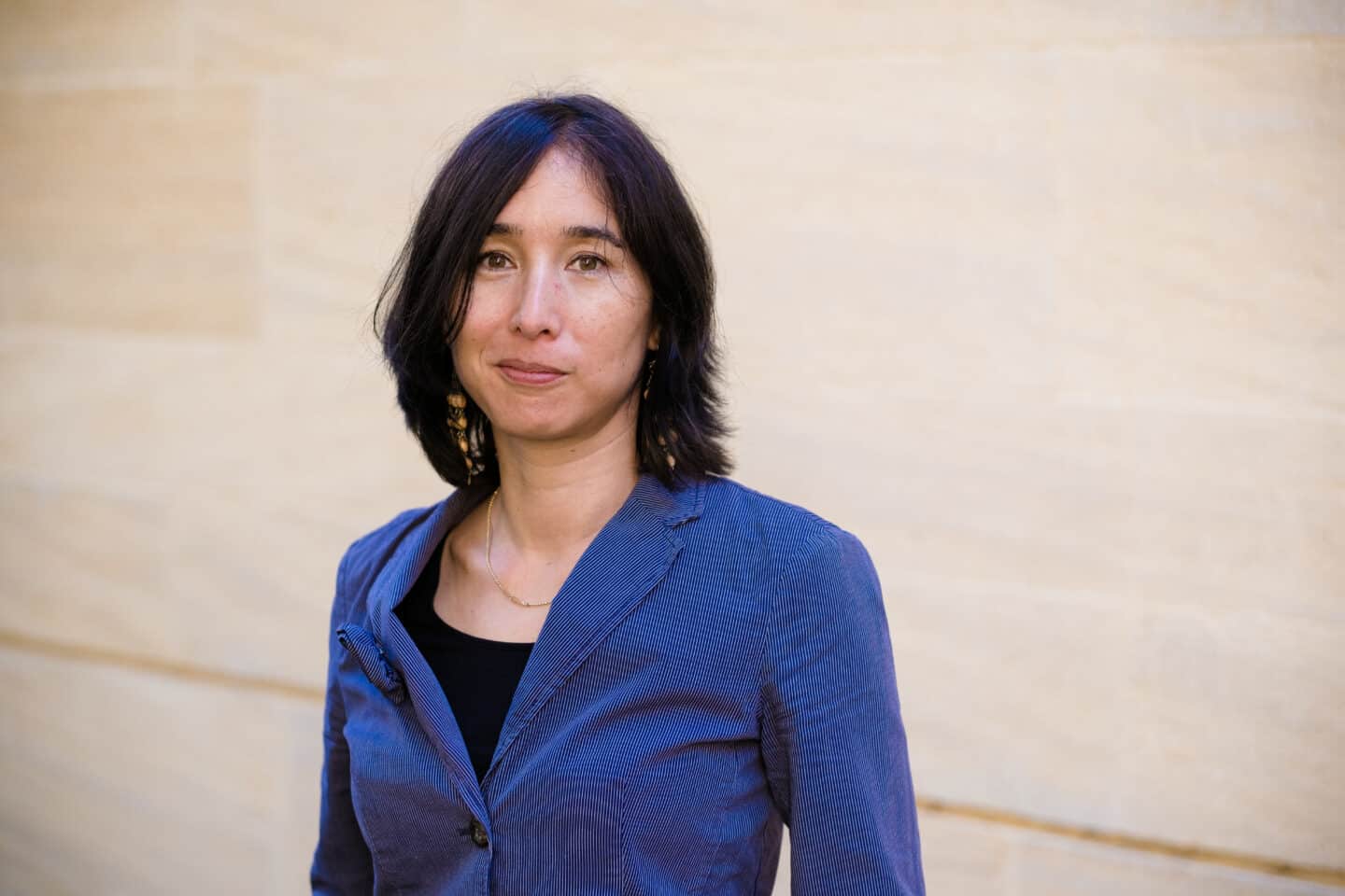 Headshot of Daniela Omlor, a woman in a blue shirt