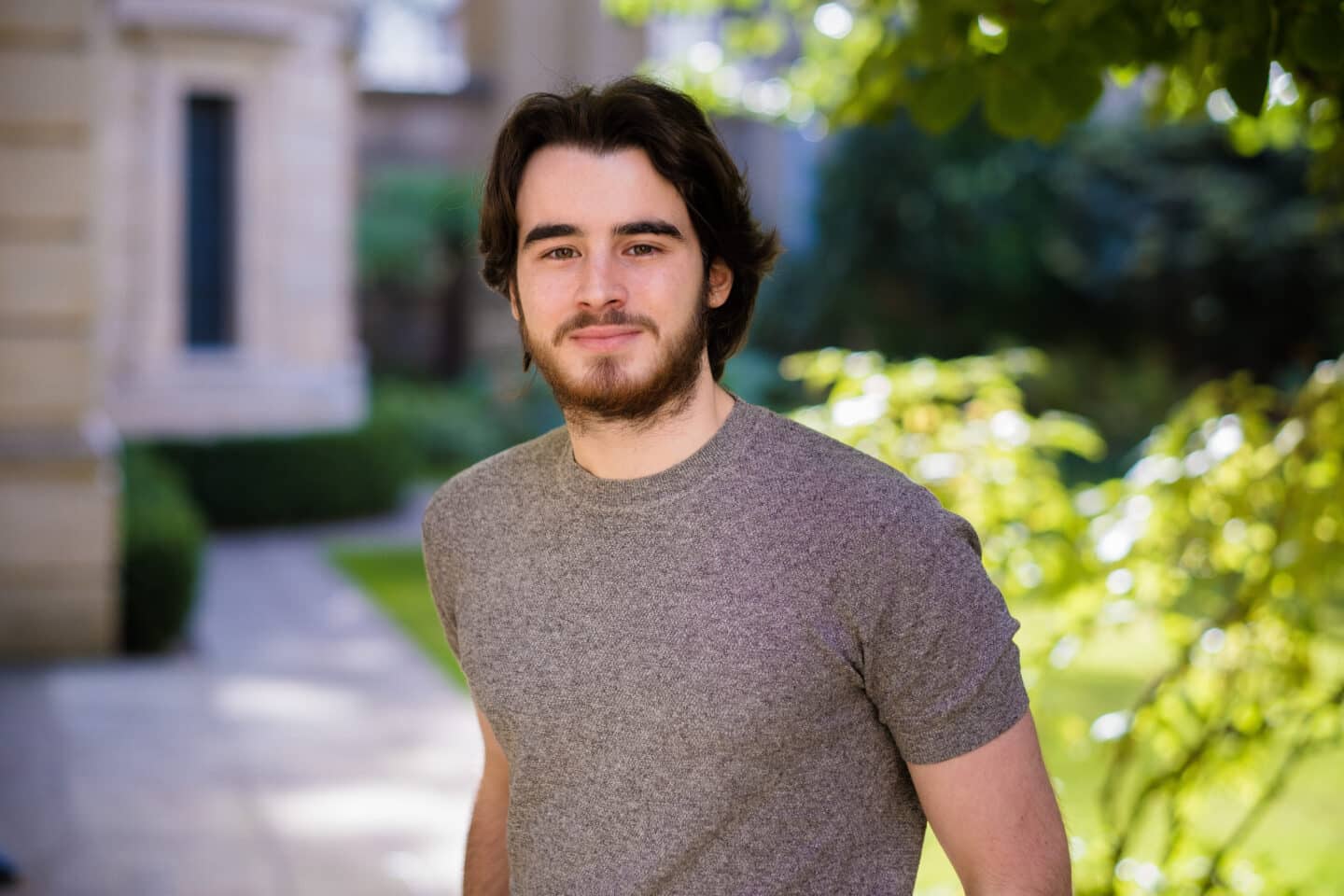 Headshot of Ebi Hanifehpour, a young man in a grey t-shirt