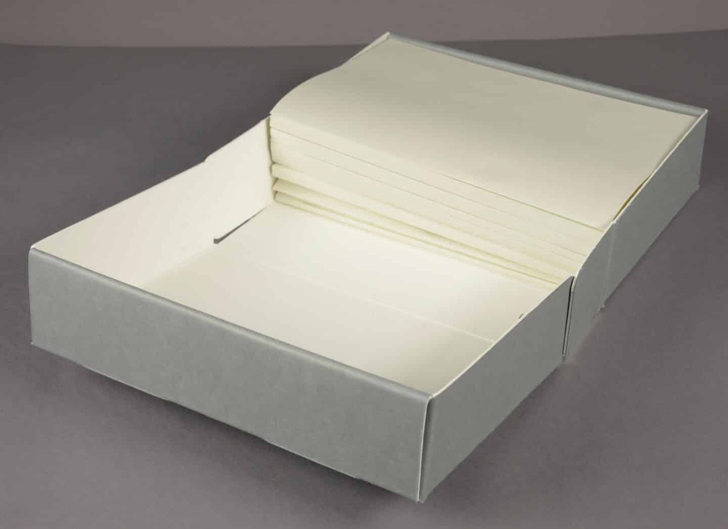 A bespoke grey box with folds of special paper that will be used to store sections of important papers