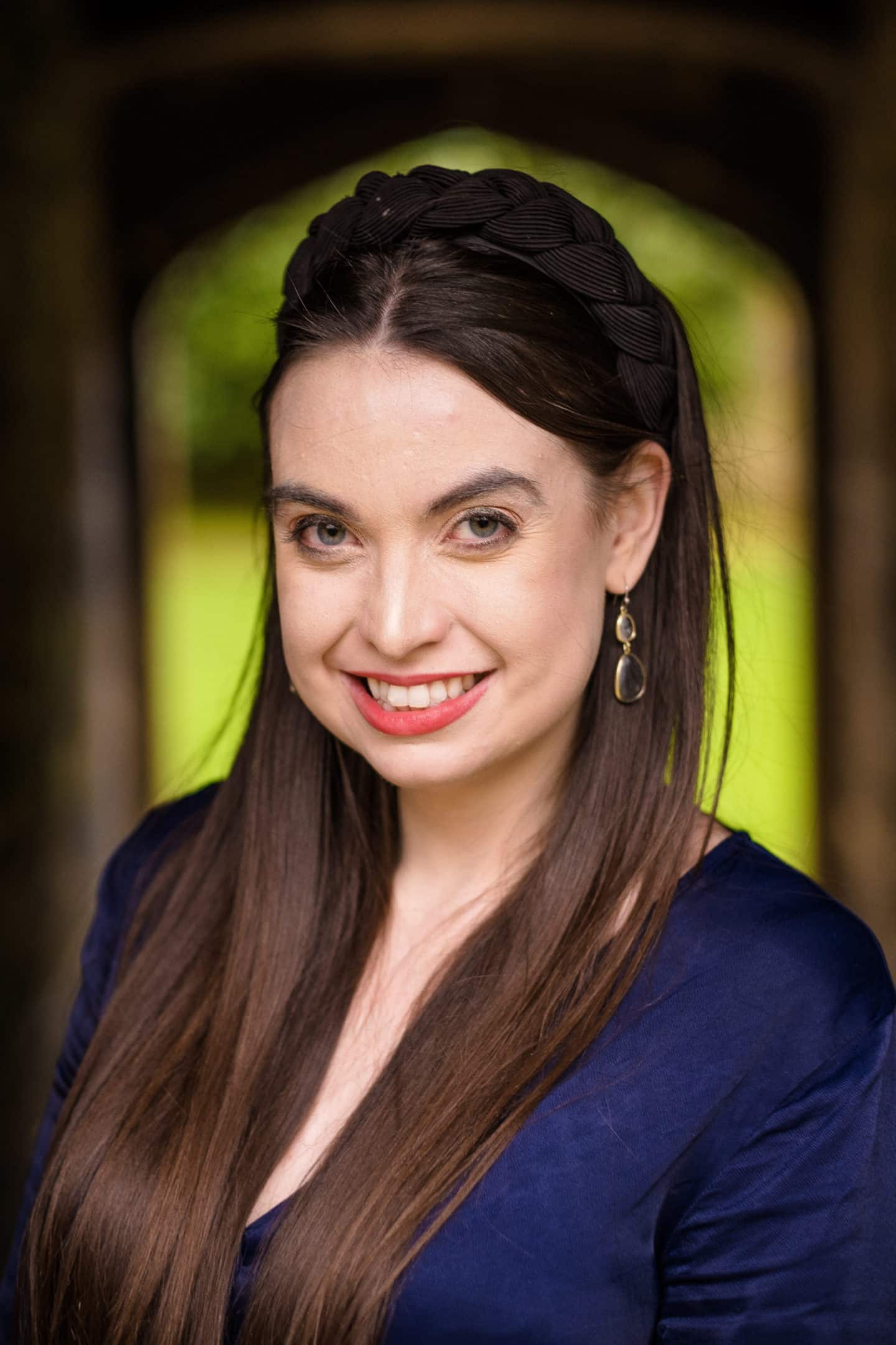 Headshot of Grace Heaton, a woman in a blue top