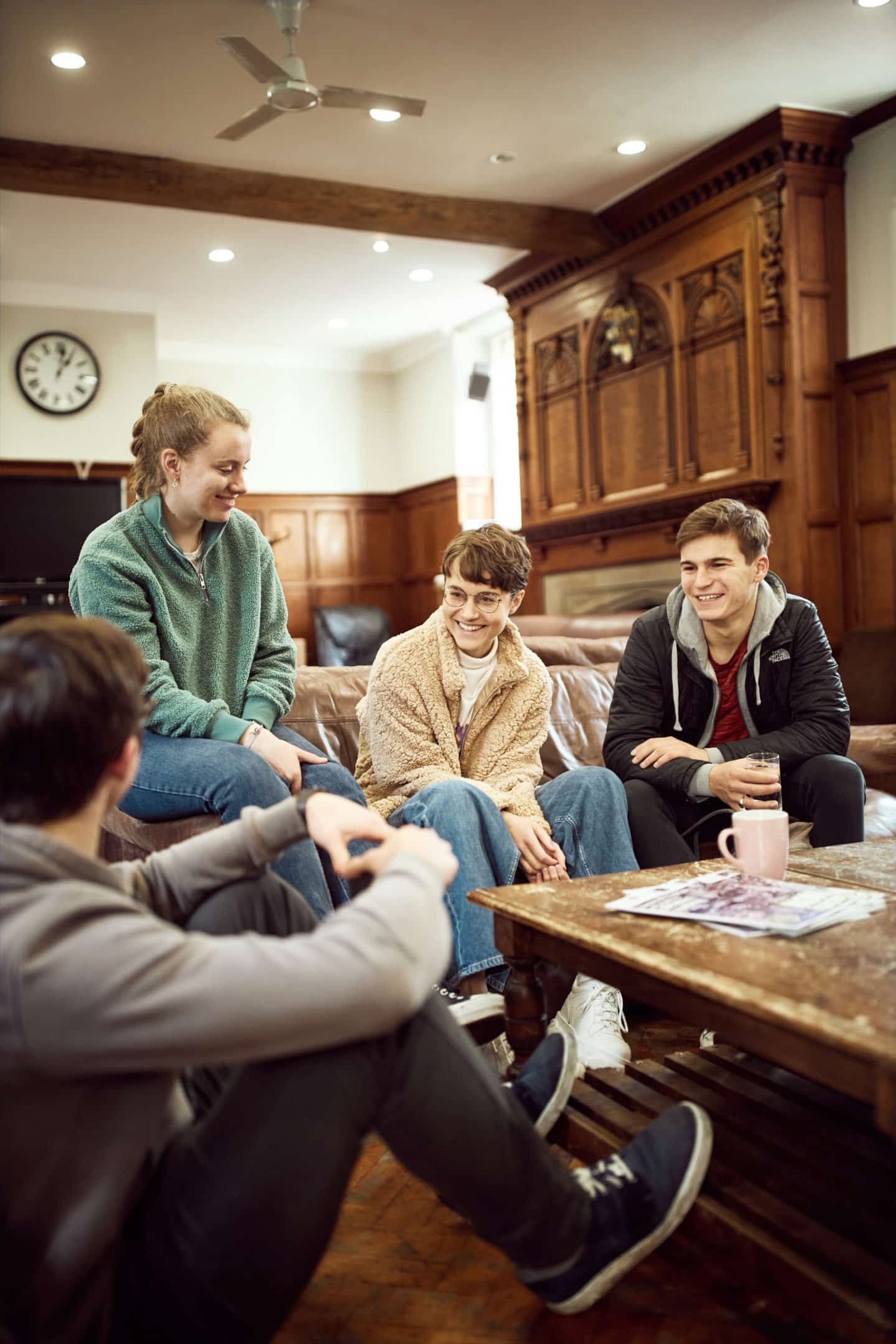 Students sitting around a table in the Lincoln College JCR