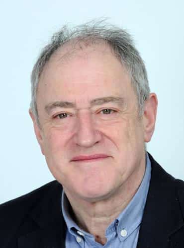 Headshot of Professor John Fox, a man in a suit