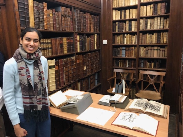 Nupur Patel pictured with her exhibition 'Early Modern Narratives of Indigenous People' at an Unlocking the Senior Library event