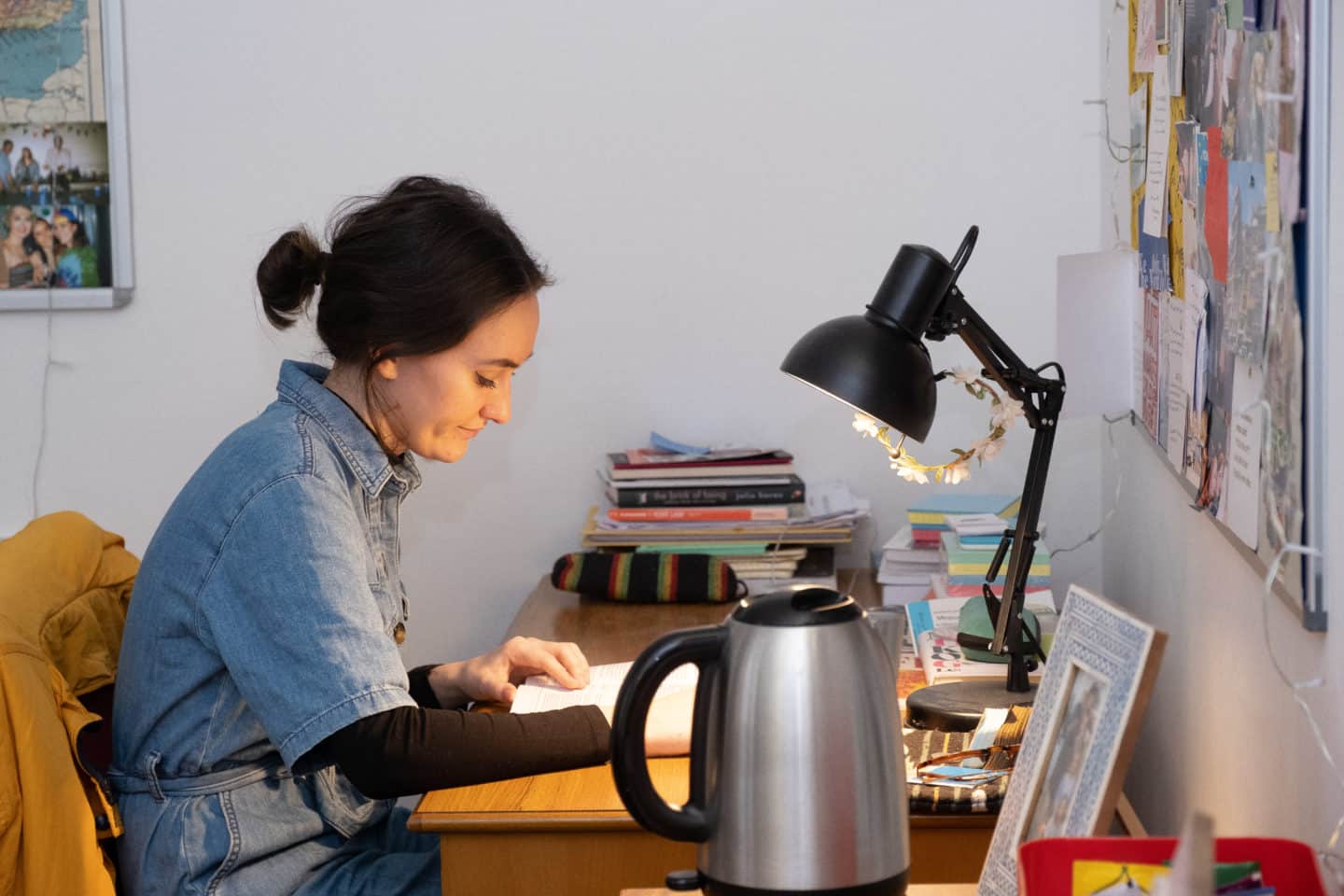 Student reading at her desk in a bedroom in Bear Lane