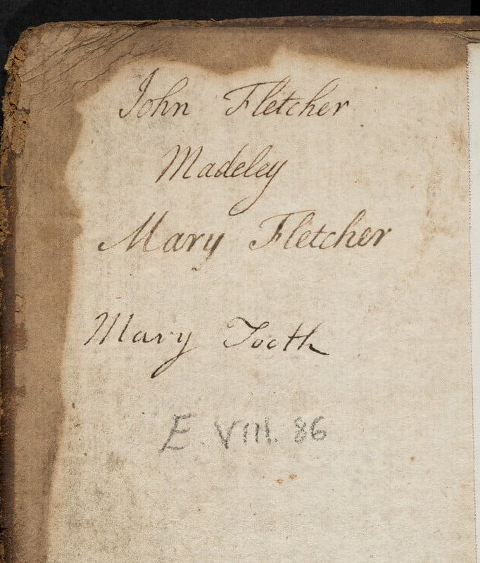 Old page with handwritten text reading 'John Fletcher Madeley, Mary Fletcher, Mary Tooth, E.VIII.86'